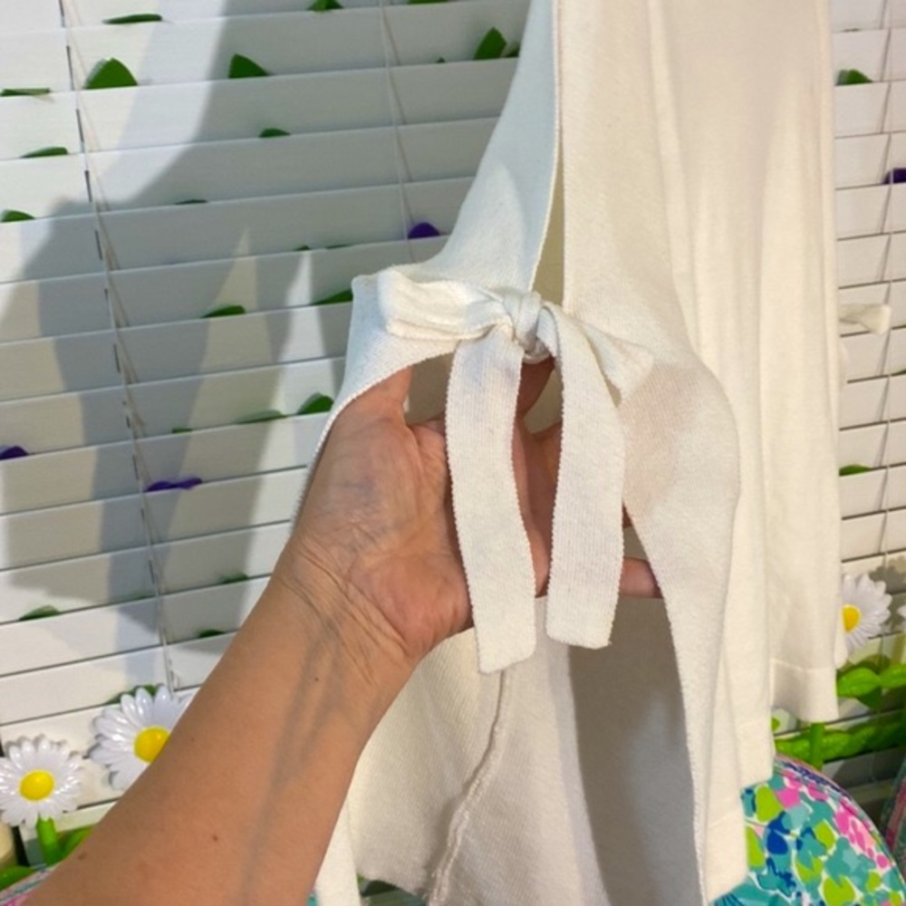 JustFab creamy white sweater top with unique open sleeves tie at the elbows